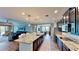 Spacious kitchen with stainless steel appliances, granite countertops and a large island with seating at 15510 Lake Burnett Shore Ct, Winter Garden, FL 34787