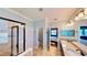 Well-lit bathroom with double sinks, granite countertops, and glass shower, connected to the main bedroom at 15510 Lake Burnett Shore Ct, Winter Garden, FL 34787