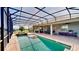 Beautiful in-ground pool and lanai with view of the lake, perfect for entertaining outdoors at 15510 Lake Burnett Shore Ct, Winter Garden, FL 34787