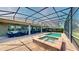 Relaxing enclosed outdoor pool area with hot tub and patio furniture, perfect for entertaining at 15510 Lake Burnett Shore Ct, Winter Garden, FL 34787