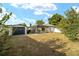 Explore the backyard featuring a screened-in pool and separate storage shed, offering both recreation and functionality at 16190 Sw 16Th Ct, Ocala, FL 34473