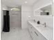 Spacious bathroom featuring marble floors, dual sinks and large shower at 16190 Sw 16Th Ct, Ocala, FL 34473