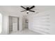 Spacious bedroom with custom shelves and tiled floor, enhanced by natural light at 16190 Sw 16Th Ct, Ocala, FL 34473