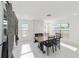 Sun-lit dining room with marble floors, stylish fireplace and views through a glass window at 16190 Sw 16Th Ct, Ocala, FL 34473
