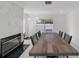 Dining room with large table and stylish fireplace at 16190 Sw 16Th Ct, Ocala, FL 34473