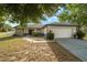 A beautiful home with a well-maintained lawn, a wide garage, and tasteful landscaping at 16190 Sw 16Th Ct, Ocala, FL 34473