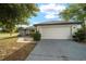 Charming home featuring a wide garage and stone accents that add to the curb appeal at 16190 Sw 16Th Ct, Ocala, FL 34473