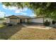 Attractive single Gathering home featuring stone accents and a manicured front yard that enhances curb appeal at 16190 Sw 16Th Ct, Ocala, FL 34473