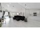 Open concept living room featuring stylish furniture, recessed lighting, and views into the modern kitchen at 16190 Sw 16Th Ct, Ocala, FL 34473