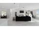 Spacious living room with vaulted ceiling, recessed lighting, modern decor, and sliding glass doors to the backyard at 16190 Sw 16Th Ct, Ocala, FL 34473