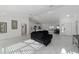 Open concept home featuring a spacious living room, modern decor, and marble tile flooring at 16190 Sw 16Th Ct, Ocala, FL 34473