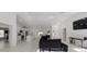 Open concept home with living room and kitchen featuring modern appliances and marble tile flooring at 16190 Sw 16Th Ct, Ocala, FL 34473