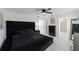 Modern main bedroom features a dark bed set, and sleek, matching furniture at 16190 Sw 16Th Ct, Ocala, FL 34473