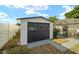 Durable outdoor shed adjacent to the screen enclosed pool area; perfect for storage solutions at 16190 Sw 16Th Ct, Ocala, FL 34473