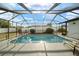 Screened-in pool with outdoor seating and a bright backyard at 16190 Sw 16Th Ct, Ocala, FL 34473