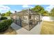 Screened-in pool area in a backyard setting with lots of greenery at 16190 Sw 16Th Ct, Ocala, FL 34473