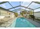 Relax in the screened-in pool area, equipped with an outdoor dining set and lounge chairs for entertaining and unwinding at 16190 Sw 16Th Ct, Ocala, FL 34473