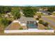 Private backyard featuring a screened pool and patio area, surrounded by a white vinyl fence at 16190 Sw 16Th Ct, Ocala, FL 34473