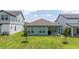 A well-maintained backyard showcasing the home's exterior and providing a serene outdoor space at 16489 Silver Brook Way, Winter Garden, FL 34787