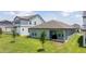 A spacious backyard with green grass and a patio, perfect for outdoor entertaining at 16489 Silver Brook Way, Winter Garden, FL 34787