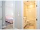 Bathroom connected to bedroom with a combination shower and tub, complete with modern fixtures and ample lighting at 16489 Silver Brook Way, Winter Garden, FL 34787
