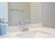 Bathroom featuring white quartz countertops, modern chrome faucet, and a sleek white sink at 16489 Silver Brook Way, Winter Garden, FL 34787