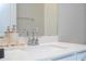 Bathroom featuring a bright white countertop with a modern faucet and stylish decor at 16489 Silver Brook Way, Winter Garden, FL 34787