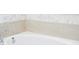 Close up on a white bathtub with marble and tile accents at 16489 Silver Brook Way, Winter Garden, FL 34787