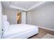 Bright bedroom with white walls, wood floors, and natural light from the window at 16489 Silver Brook Way, Winter Garden, FL 34787