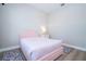 Bedroom featuring a pink bed, hardwood floors and decorative rugs at 16489 Silver Brook Way, Winter Garden, FL 34787