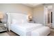 Luxurious bedroom featuring a plush, tufted headboard, and neutral color palette at 16489 Silver Brook Way, Winter Garden, FL 34787
