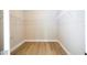 Empty walk-in closet with laminate flooring and metal shelving at 16489 Silver Brook Way, Winter Garden, FL 34787