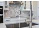 Close up of kitchen sink featuring stainless steel faucet and modern countertops at 16489 Silver Brook Way, Winter Garden, FL 34787