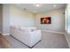 Cozy living room features a comfortable sofa and mounted television, perfect for relaxation and entertainment at 16489 Silver Brook Way, Winter Garden, FL 34787