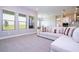 Spacious living room integrates kitchen and dining areas with large windows providing ample natural light and views at 16489 Silver Brook Way, Winter Garden, FL 34787