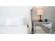 The main bedroom features a jeweled headboard and mirrored nightstand at 16489 Silver Brook Way, Winter Garden, FL 34787