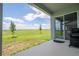Relaxing outdoor patio featuring an open yard and view from the sliding door to the home's interior at 16489 Silver Brook Way, Winter Garden, FL 34787
