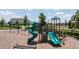 The community playground has slides, swings, and shaded areas for children at 16489 Silver Brook Way, Winter Garden, FL 34787