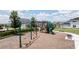 Swings and playground equipment in a well-maintained community space at 16489 Silver Brook Way, Winter Garden, FL 34787
