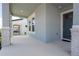 Charming front porch with blue door and grey trim, creating a welcoming entrance to the home at 16489 Silver Brook Way, Winter Garden, FL 34787
