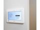 Close-up of a modern security panel with a clear display showing system status, enhancing home safety at 16489 Silver Brook Way, Winter Garden, FL 34787