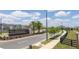 Street view of Silverleaf at Hamlin featuring a landscaped median, sidewalks, and attractive neighborhood entrance at 16489 Silver Brook Way, Winter Garden, FL 34787
