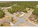 An elevated shot displays the property's well-maintained lawn and proximity to a quiet, paved road intersection at 17762 Sw 33Rd Ter, Ocala, FL 34473