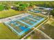 Aerial view of community basketball courts, green space, and parking at 17762 Sw 33Rd Ter, Ocala, FL 34473