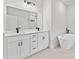 Bright bathroom with double vanity, quartz counters, matte black fixtures and a free-standing tub at 17762 Sw 33Rd Ter, Ocala, FL 34473