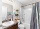 Bright bathroom features a shower-tub combo and vanity with ample counter space at 1805 Kingsmill Dr, Bartow, FL 33830