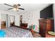 Comfortable bedroom featuring a large bed, accent chair and flatscreen TV at 1805 Kingsmill Dr, Bartow, FL 33830