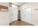 The entryway features neutral walls, decorative shelving, and a tiled floor at 1805 Kingsmill Dr, Bartow, FL 33830