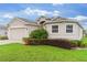 Charming single-story home featuring manicured lawn, two car garage, and lush landscaping at 1805 Kingsmill Dr, Bartow, FL 33830