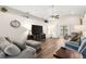 Spacious living room with wood flooring, high ceilings, and stylish furniture at 1805 Kingsmill Dr, Bartow, FL 33830